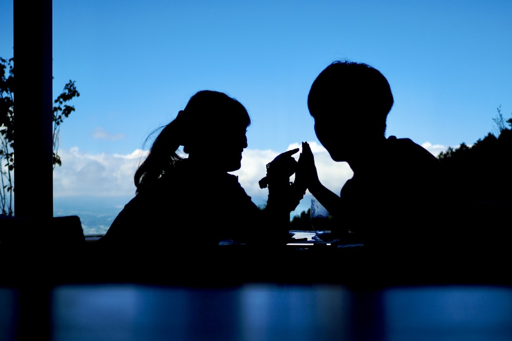 a man and a woman sitting next to each other