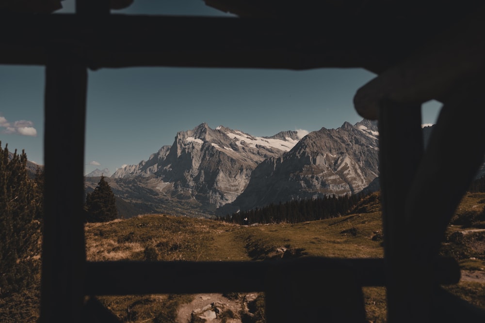 a view of a mountain range from a window