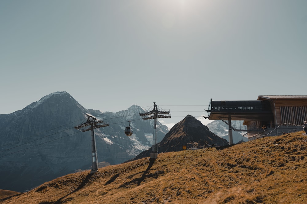 a view of a mountain with a ski lift in the foreground