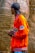 A happy customer wearing a stylish orange jacket from wearlibas.