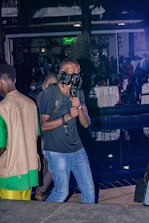 Drone filming an elegant indoor event with subtle lighting and refined guests.