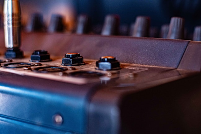A close-up of audio mixing equipment ready for use.