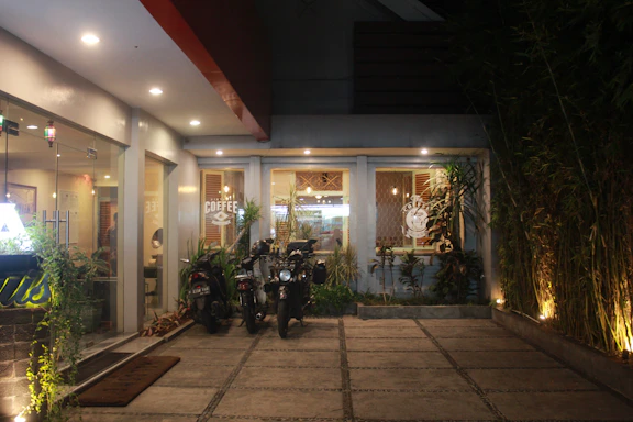 Cozy Suzuki dealership front desk with warm lighting and a welcoming staff member.