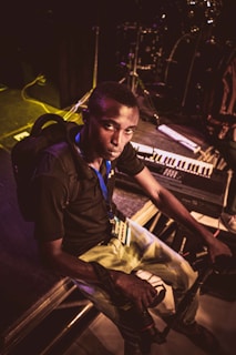 Zua posing with her instruments backstage before a show.