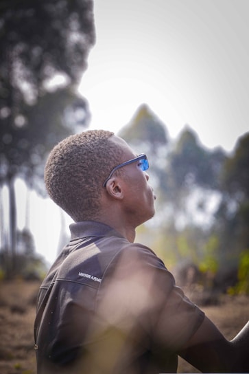 A serene outdoor scene featuring a person wearing elegant eyewear.