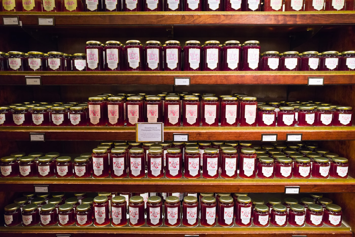 Neatly arranged pantry shelves with rows of matching jars