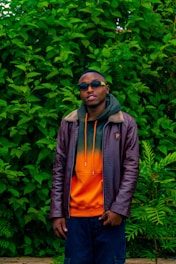 Athlete wearing a breathable, sleek sports jacket in a lush Colombian landscape.