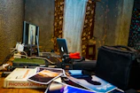 A neat desk with photography prints and editing tools scattered around.