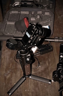 The Boya microphone displayed with its accessories laid out on a wooden table.