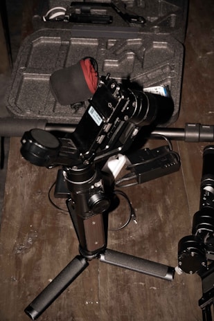 The Boya microphone displayed with its accessories laid out on a wooden table.
