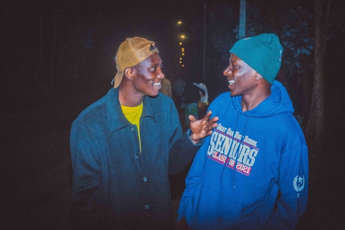 A friendly local reporter chatting with a community member outdoors.