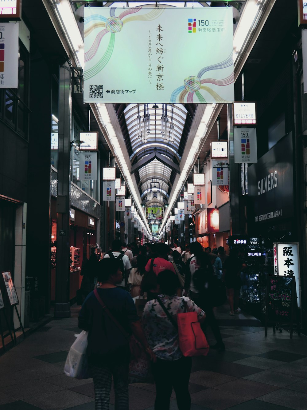 a group of people that are walking down a street