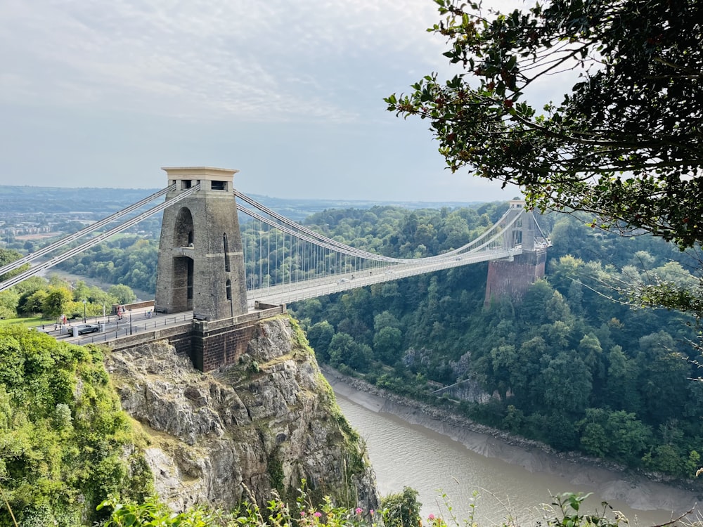 a view of a suspension bridge over a river