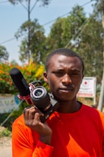 A boom mic operator capturing crisp audio during an outdoor shoot.