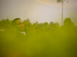 A peaceful scene of a person breathing deeply in nature, representing relief from asthma.