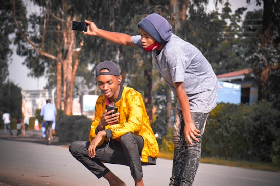 Young students using smartphones to record environmental data in Hanoi's urban streets.