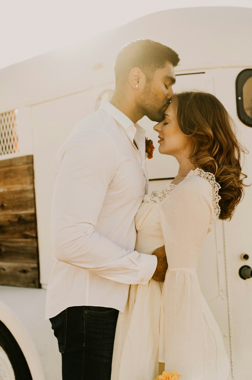 a man and a woman standing next to a food truck