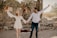 A joyful bride and groom celebrating their wedding at Alora.
