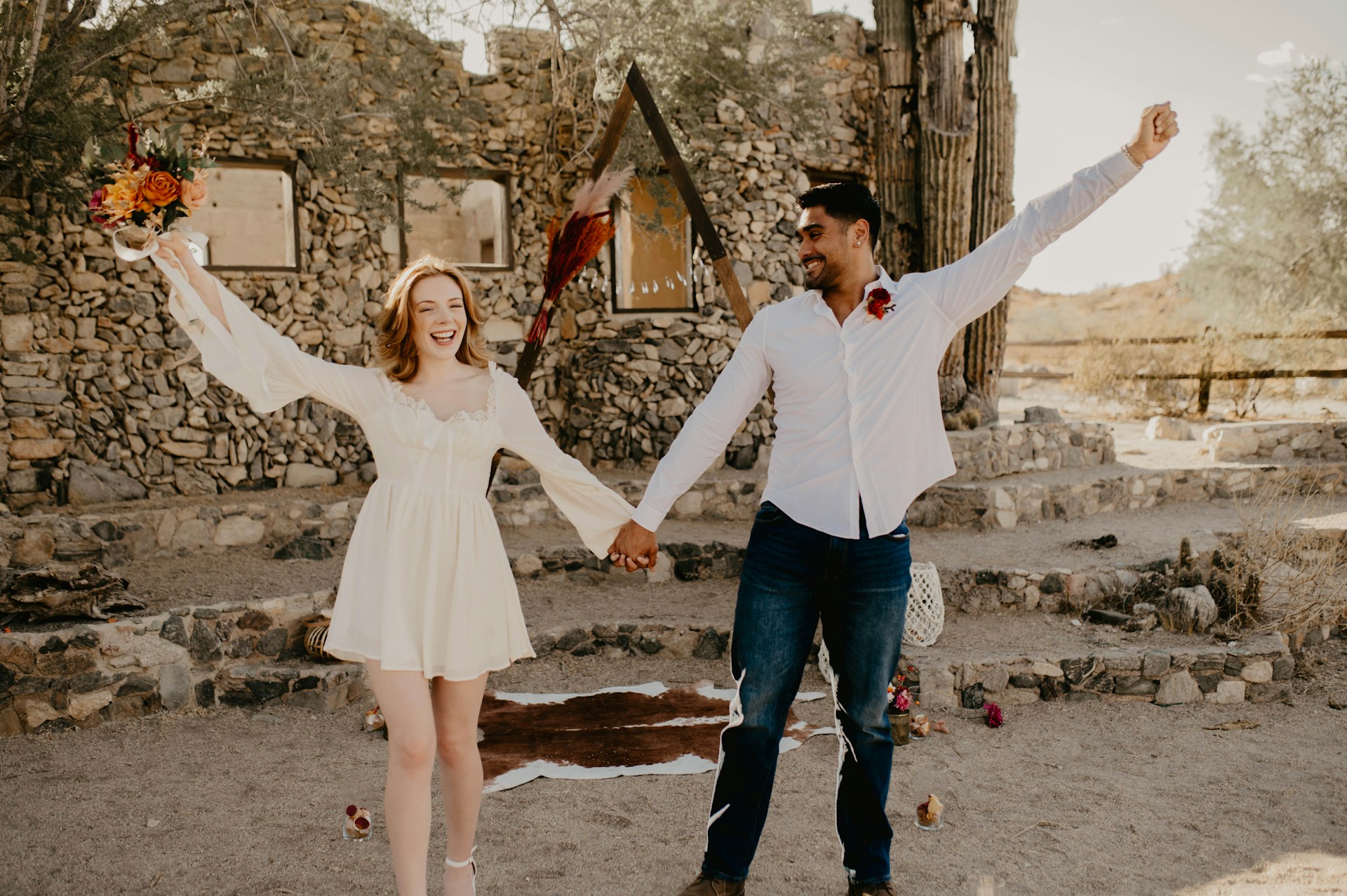 couple wearing silver-colored rings