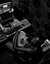 Portrait of Roger Oliveros working on manuscript editing in a cozy studio.