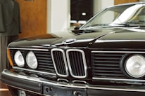 A close-up of car-themed accessories paired with stylish apparel.