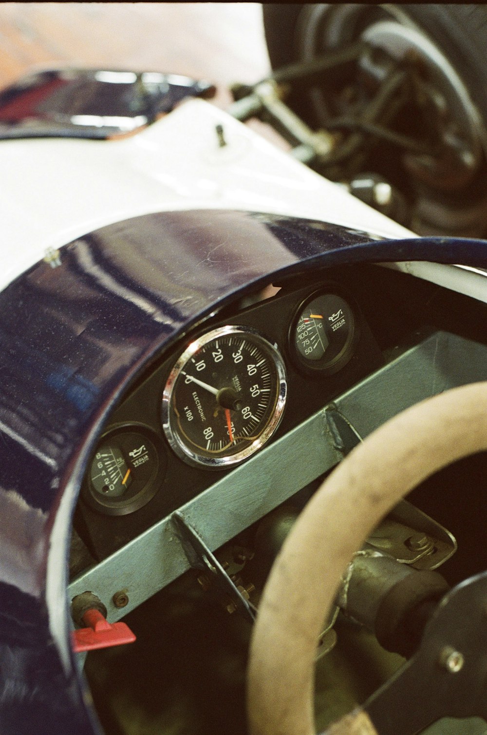 a close up of a steering wheel and dashboard of a race car