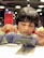 A child interacting with a tablet, immersed in a bright and playful educational app.