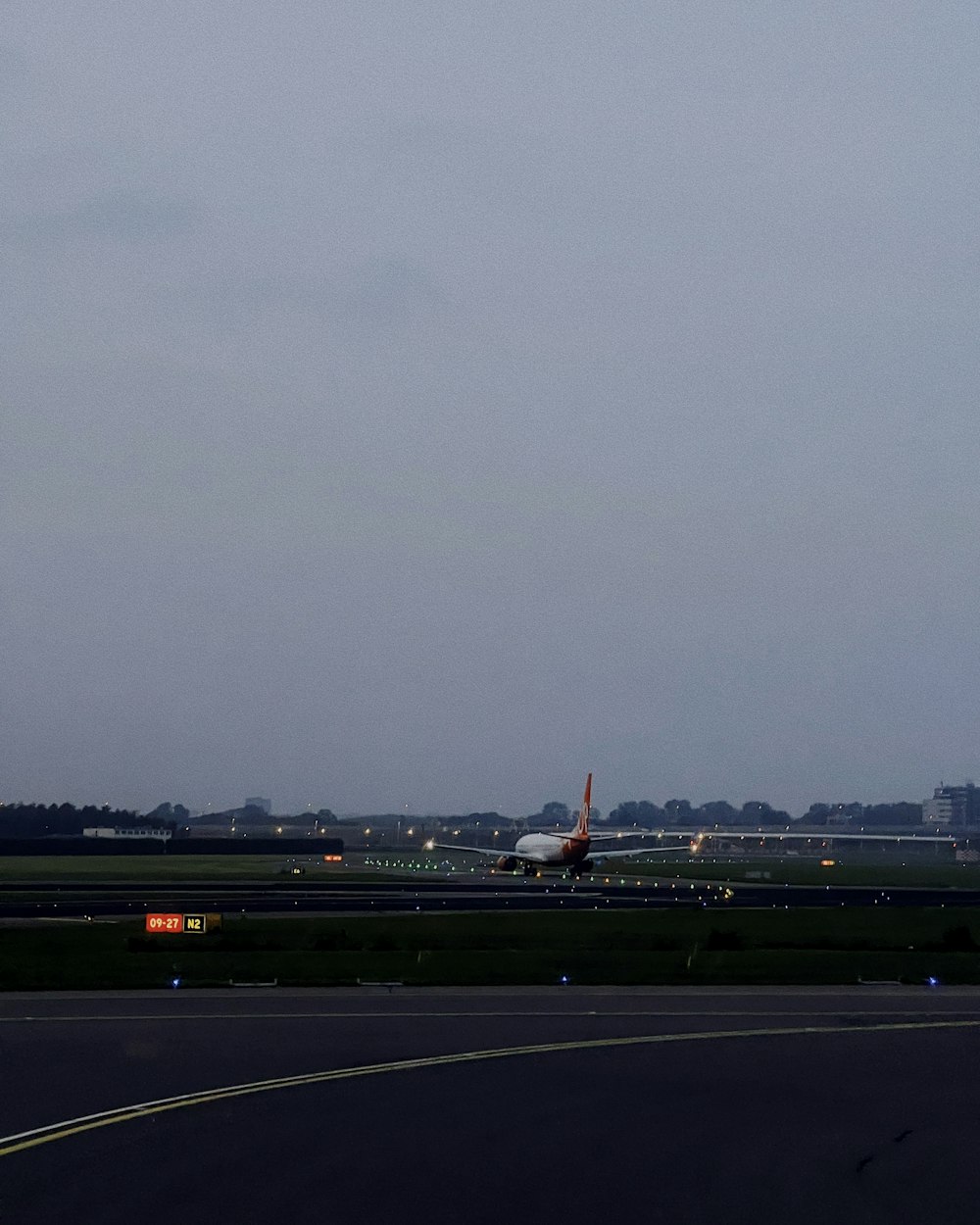 a large jetliner sitting on top of an airport runway