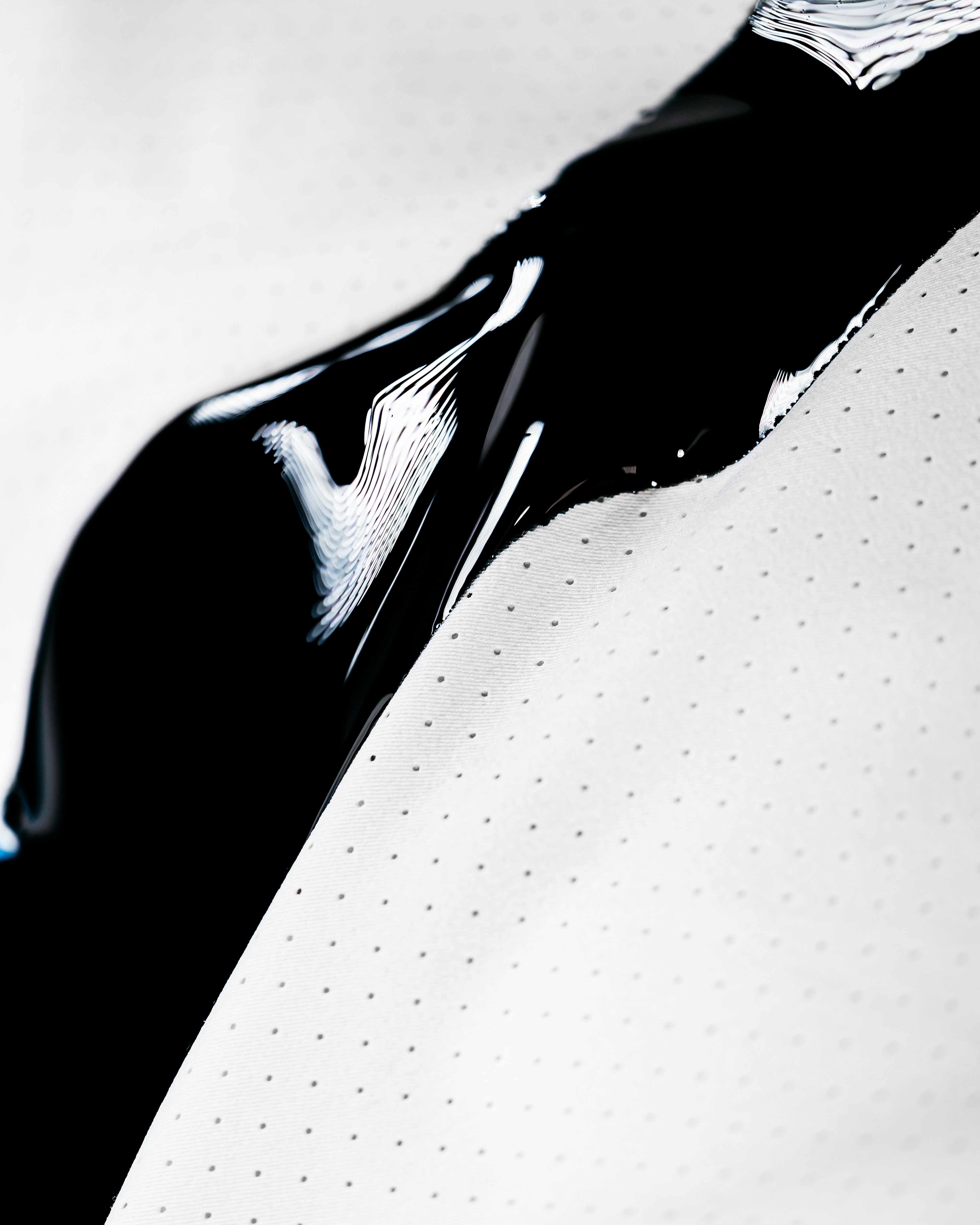 Close-up of a smooth, glossy epoxy floor in a workshop setting.