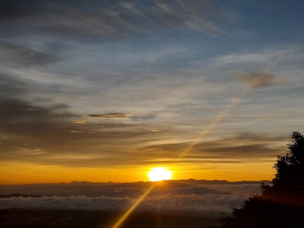 A stunning sunset over a serene landscape.