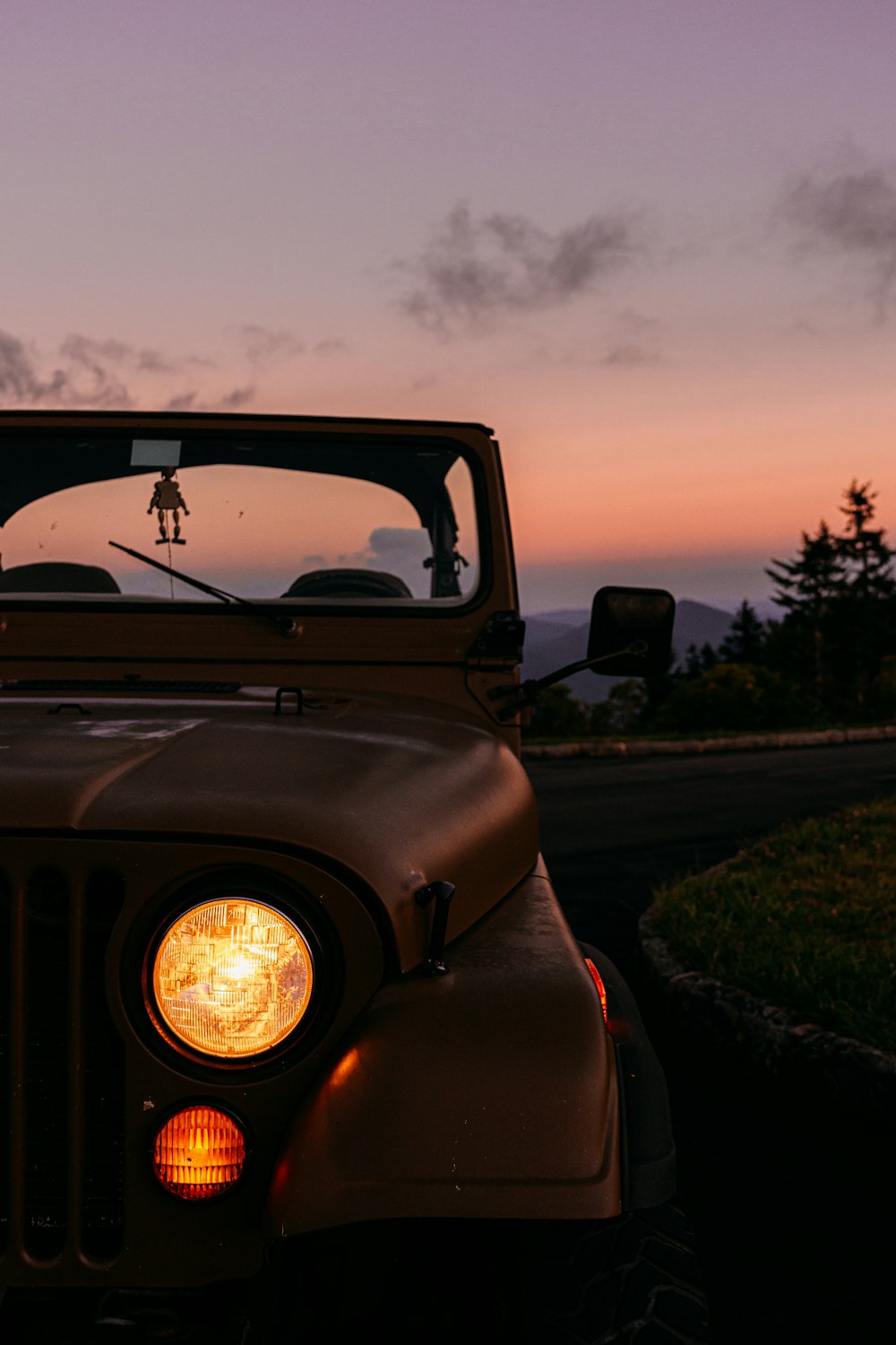 a jeep is parked on the side of the road