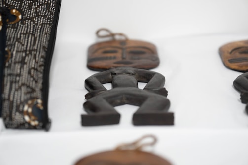 A close-up of a hand-painted wooden figure.