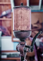 Close-up of a vintage lamp base being carefully restored by hand.