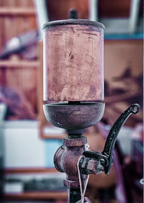 Close-up of a vintage lamp base being carefully restored by hand.
