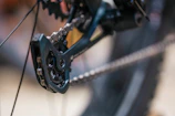 Detail shot of high-performance bike gears and chain in motion.