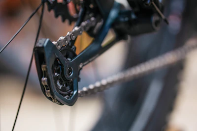 Detail shot of high-performance bike gears and chain in motion.