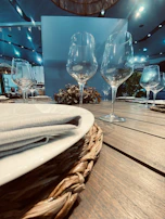 Close-up of an elegantly set dining table with fine china and sparkling glassware.