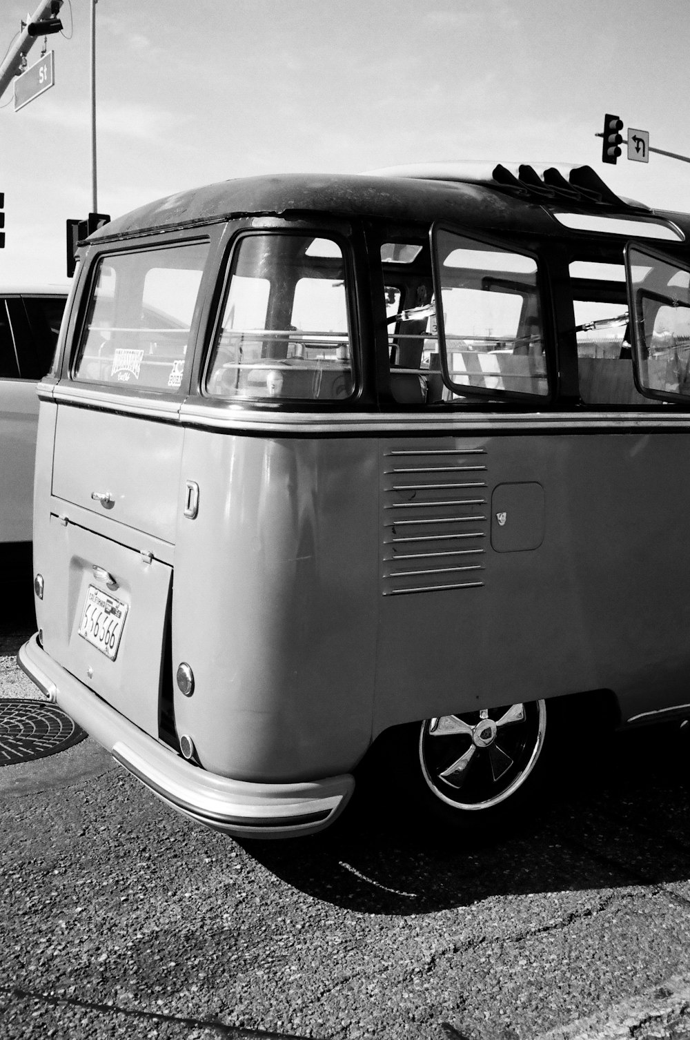 a black and white photo of an old vw bus