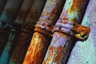 a rusted metal fence with a knot on it