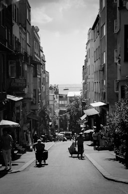 A candid black and white photo of a bustling city street, reflecting the essence of street photography.