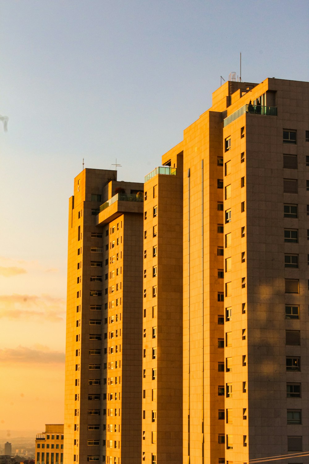 a tall building with a clock on the top of it