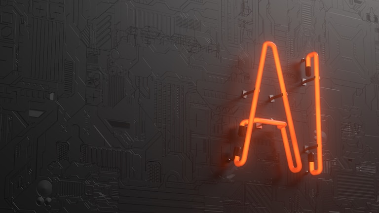 A glowing neon sign displaying the letters 'AI' is mounted on a dark, textured wall that resembles a circuit board or technological pattern.