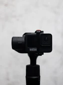 A sleek snapgo360 camera set against a minimalist white background, highlighting its premium design.