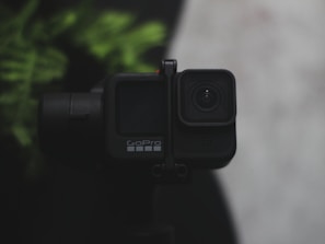 A close-up of a rugged GoPro camera ready for action sports