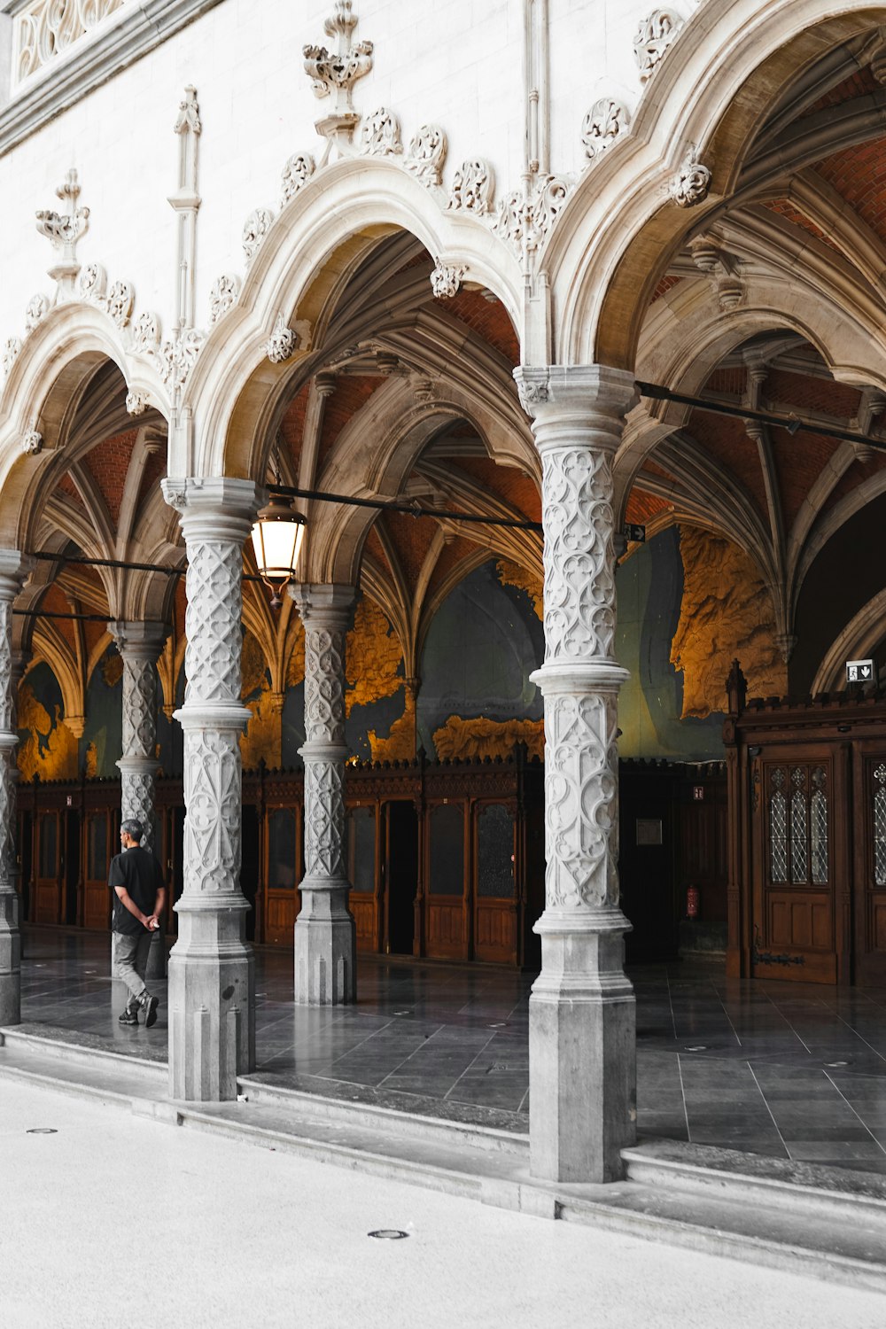 a person sitting on a bench in a building