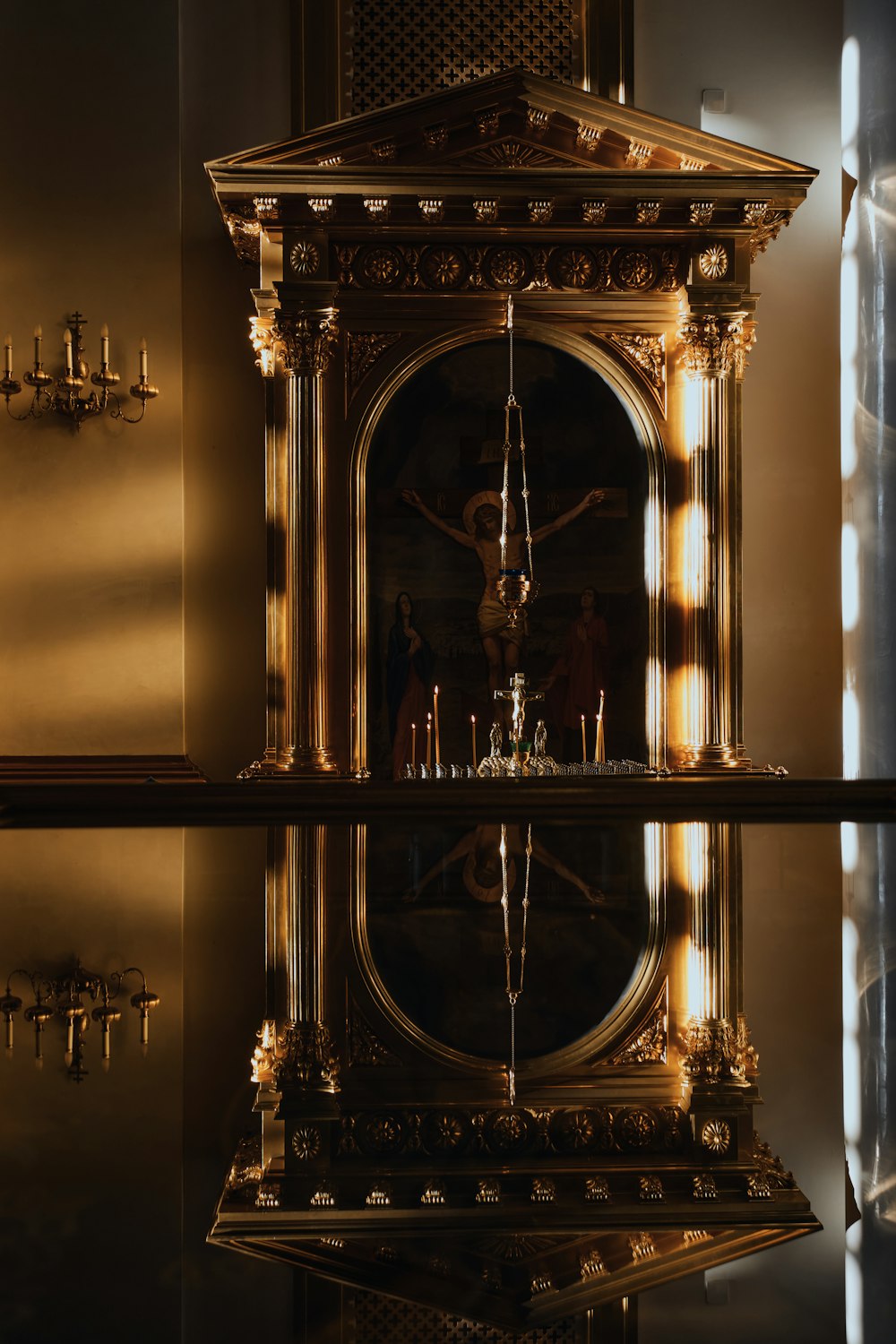 a large golden clock sitting on top of a table