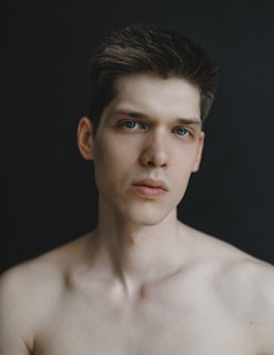 A perfectly sized ID photo of a young adult with neutral expression and clean background