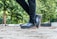 Close-up of a person walking on a paved path wearing comfortable shoes.