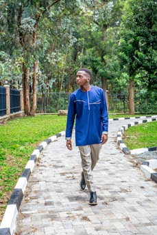 Happy customer wearing comfortable pants while walking in a city park.