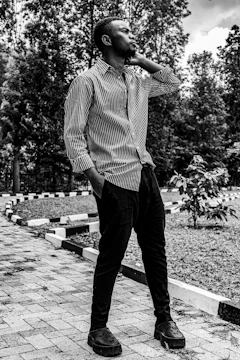 A researcher conducting environmental psychology studies outdoors amid lush greenery